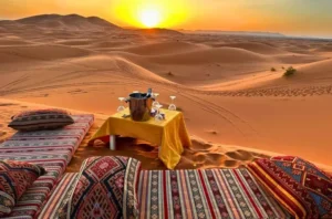 Merzouga Sahara Desert Travel Guide - Panoramic view of the golden Erg Chebbi dunes at sunset