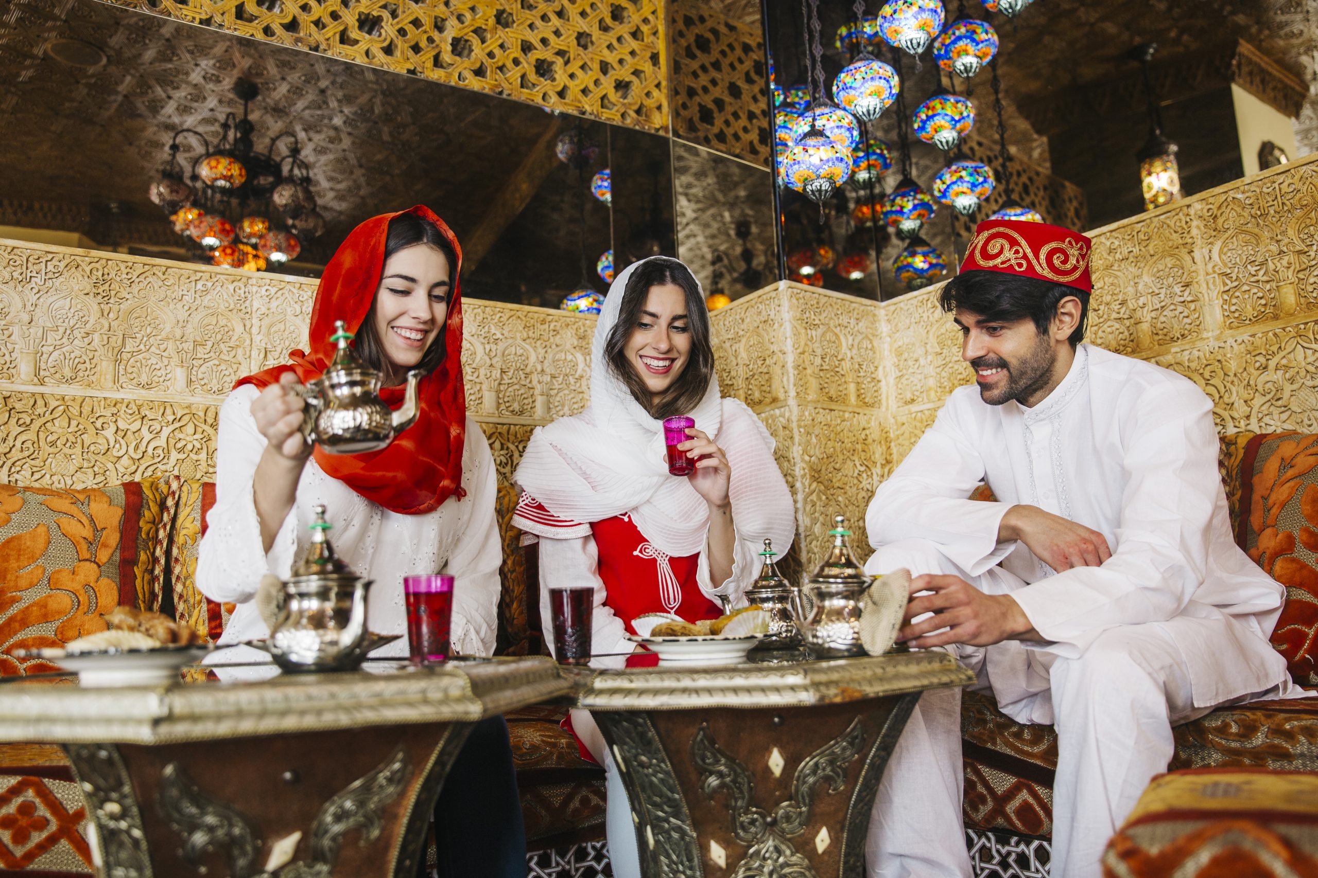 Friends enjoying Moroccan food together in a traditional restaurant