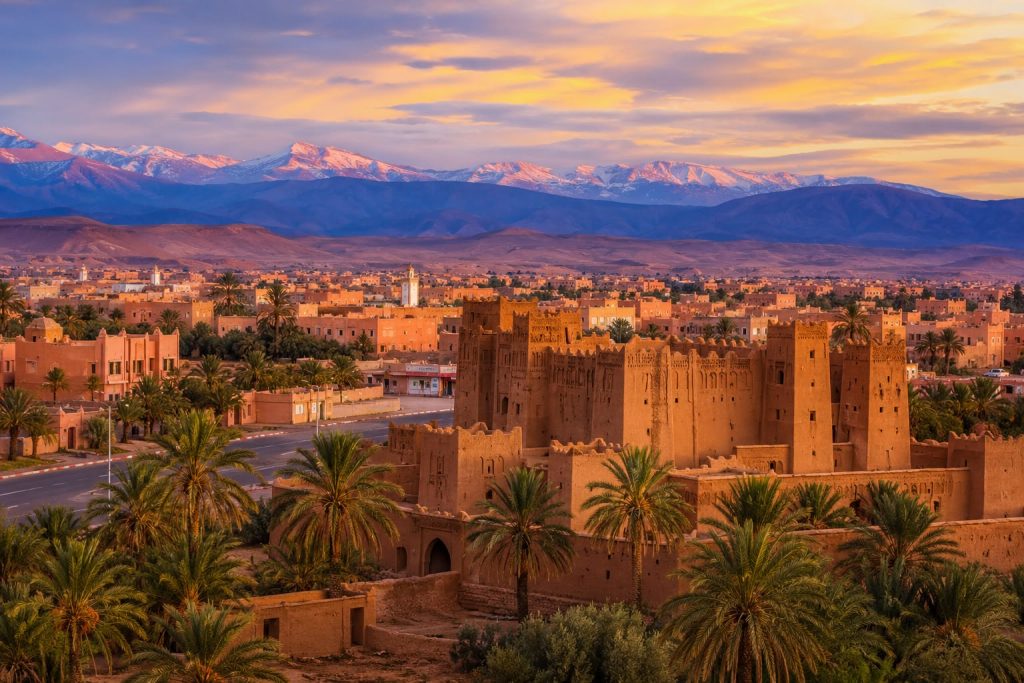 Panoramic view of Ouarzazate with Taourirt Kasbah and the Atlas Mountains