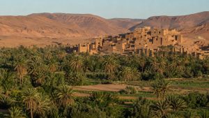 Earthen kasbahs and date-palm gardens in the Draa Valley near Zagora in southern Morocco