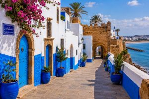 Kasbah of the Udayas in Rabat, Morocco, featuring blue and white houses, historic fortress walls, Atlantic Ocean views, and picturesque streets