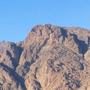 Natural Lion’s Head rock formation on Jbel Lekst overlooking Ameln Valley near Tafraoute, Morocco